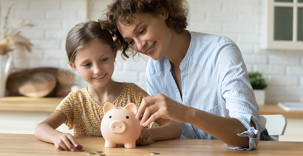 Woman and child with a piggy bank